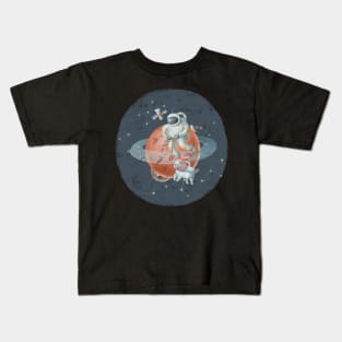 Spaceman riding scooter on Saturn Kids T-Shirt